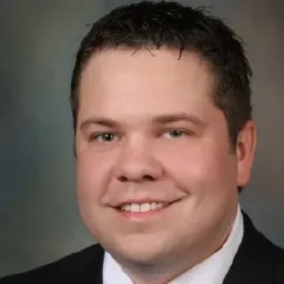 Greg R. Cuzick - Attorney